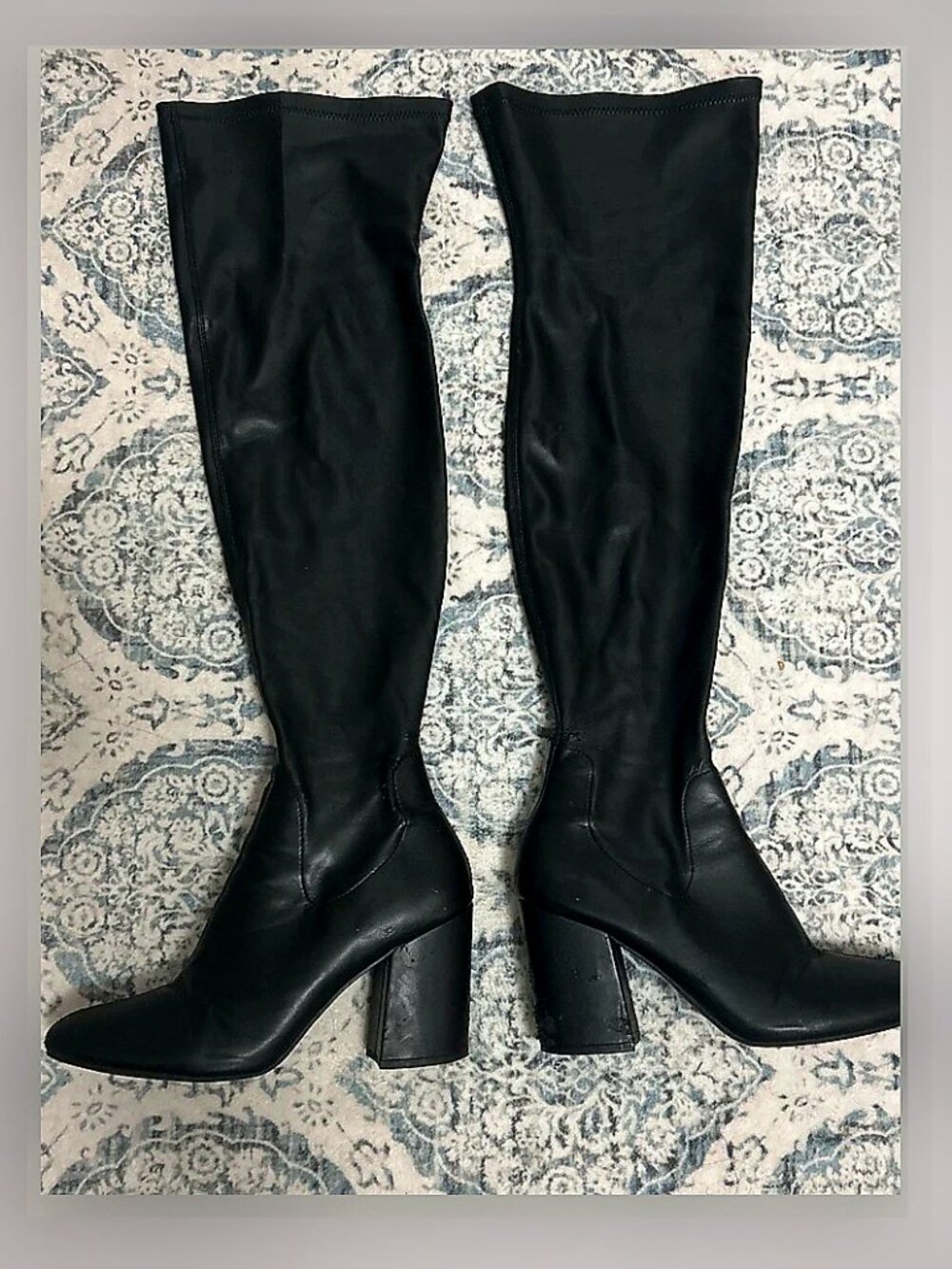 Black leather thigh high boots with heel